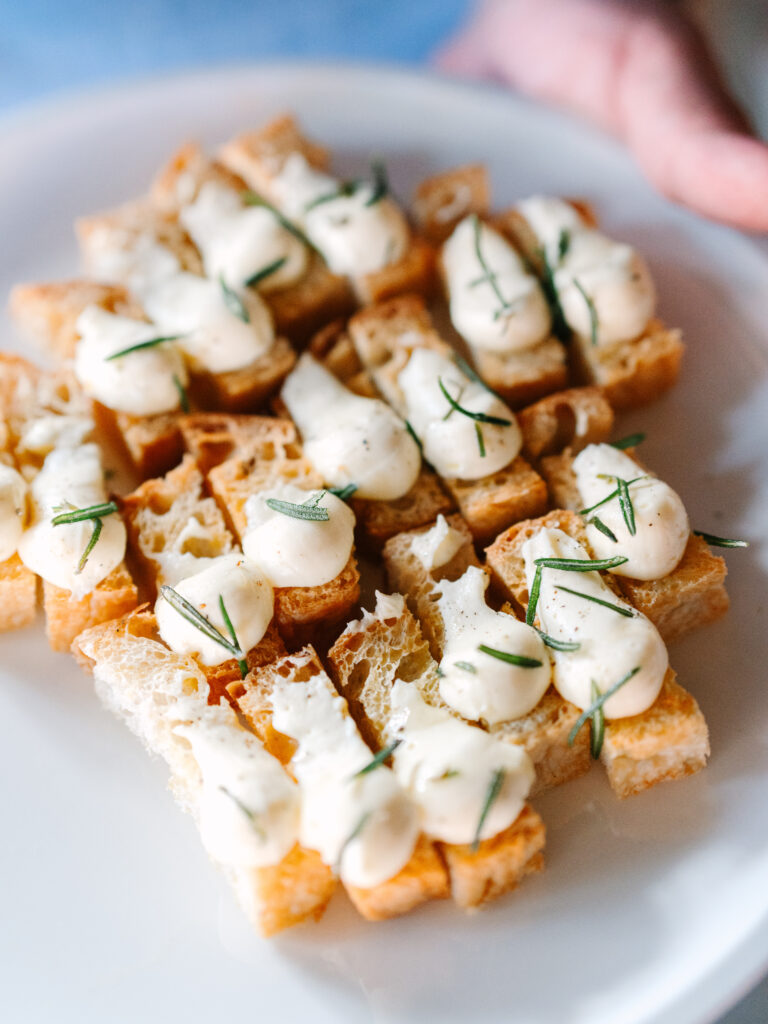 Food Worth Celebrating: Etta Restaurant focaccia appetizer is passed during an event.