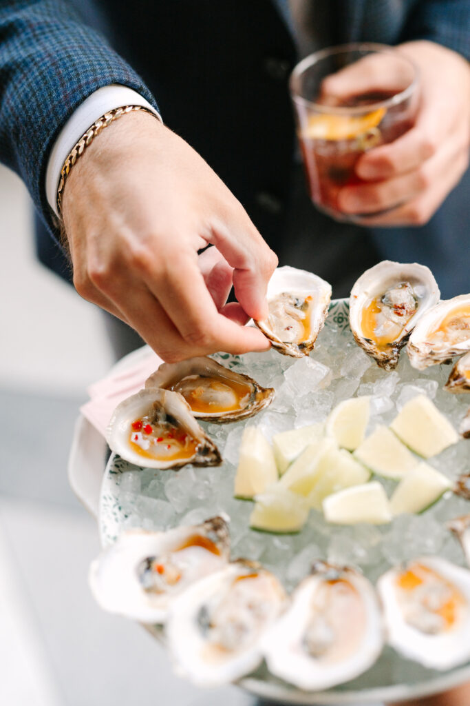 Food Worth Celebrating: Etta Restaurant oyster appetizer is passed during an event.