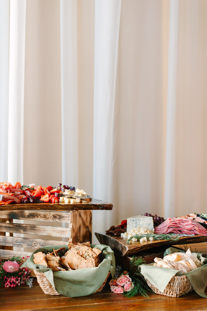 Food Worth Celebrating: Hearty Boys designed an incredible food spread for a Spring wedding complete with grapes, sliced meats and a variety of cheese. by Ashlee Cole Photography