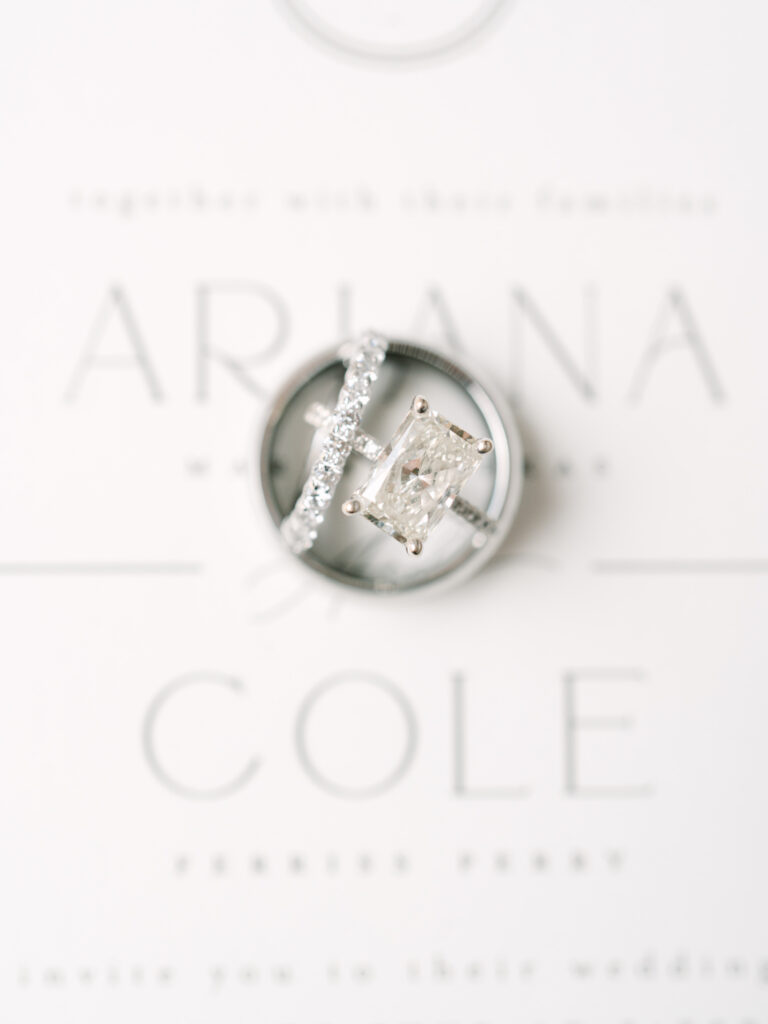 Wedding bands for the bride and groom on the invitation suite by Naperville Wedding Photographer