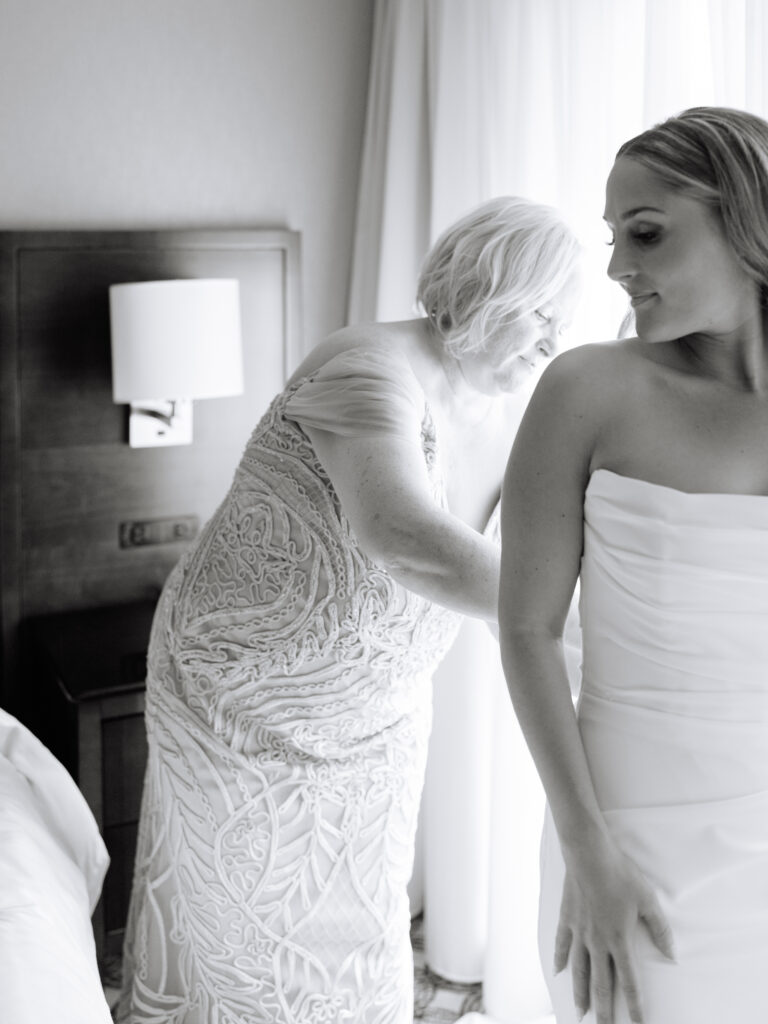 Bride getting dressed at the Marriott Naperville
