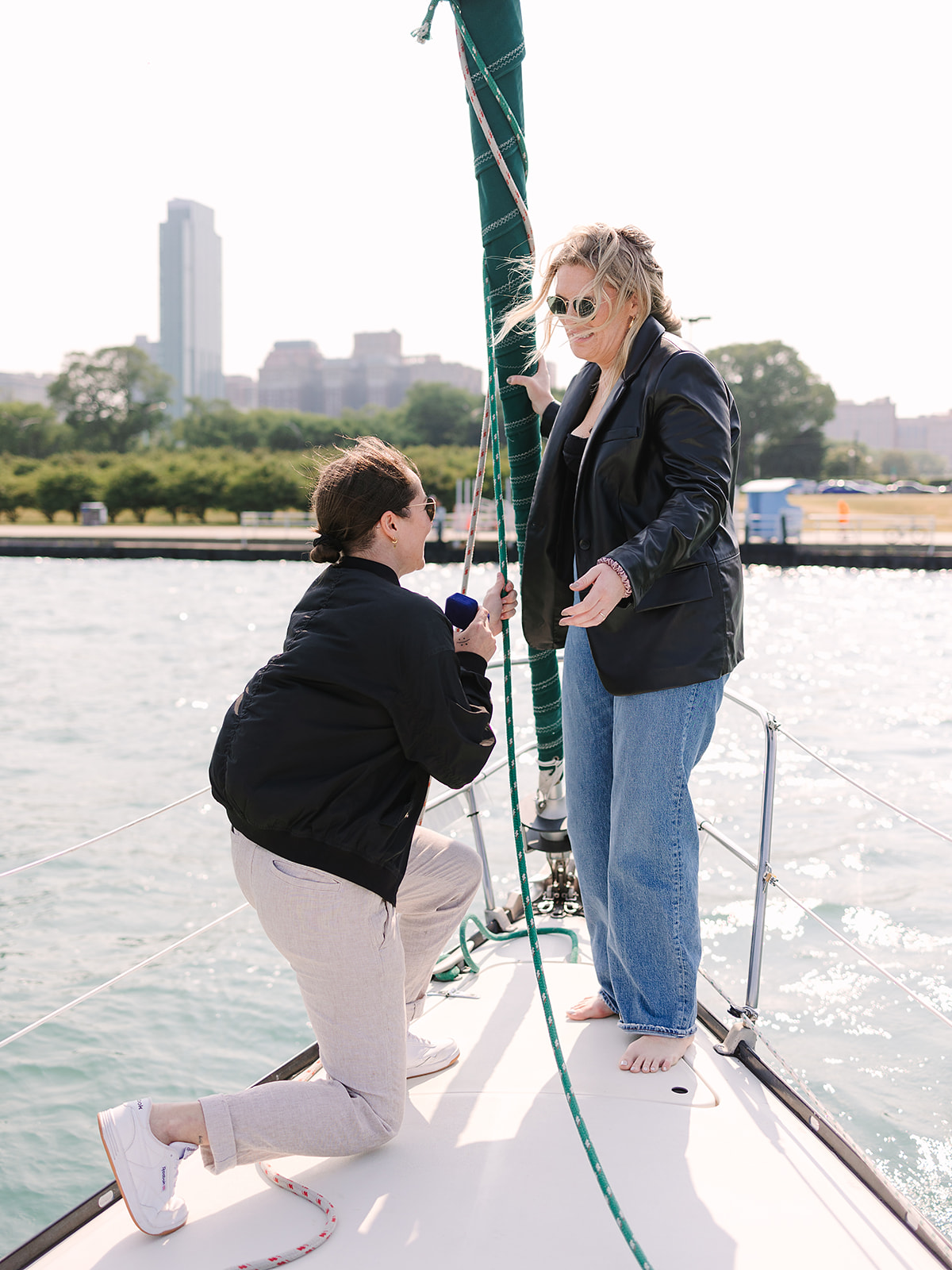 Woman proposing to her girlfriend on a boat on Lake Michigan