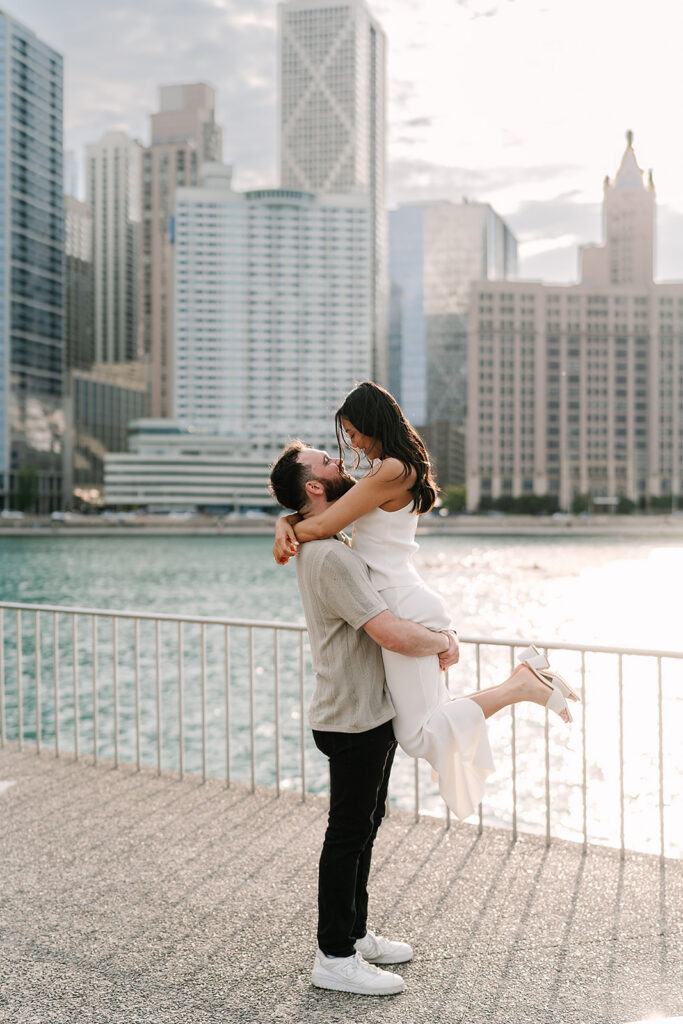 Newly engaged couple embracing at Milton Lee Olive Park
